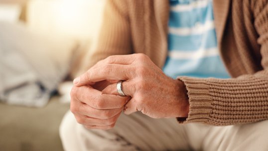 Hands, home and old man with doubt, ring and toxic relationship with divorce, sad and confused