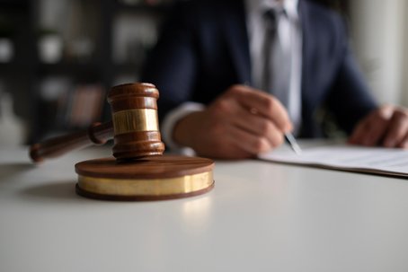 Judge or Legal advisor lawyer examining and signing legal documents